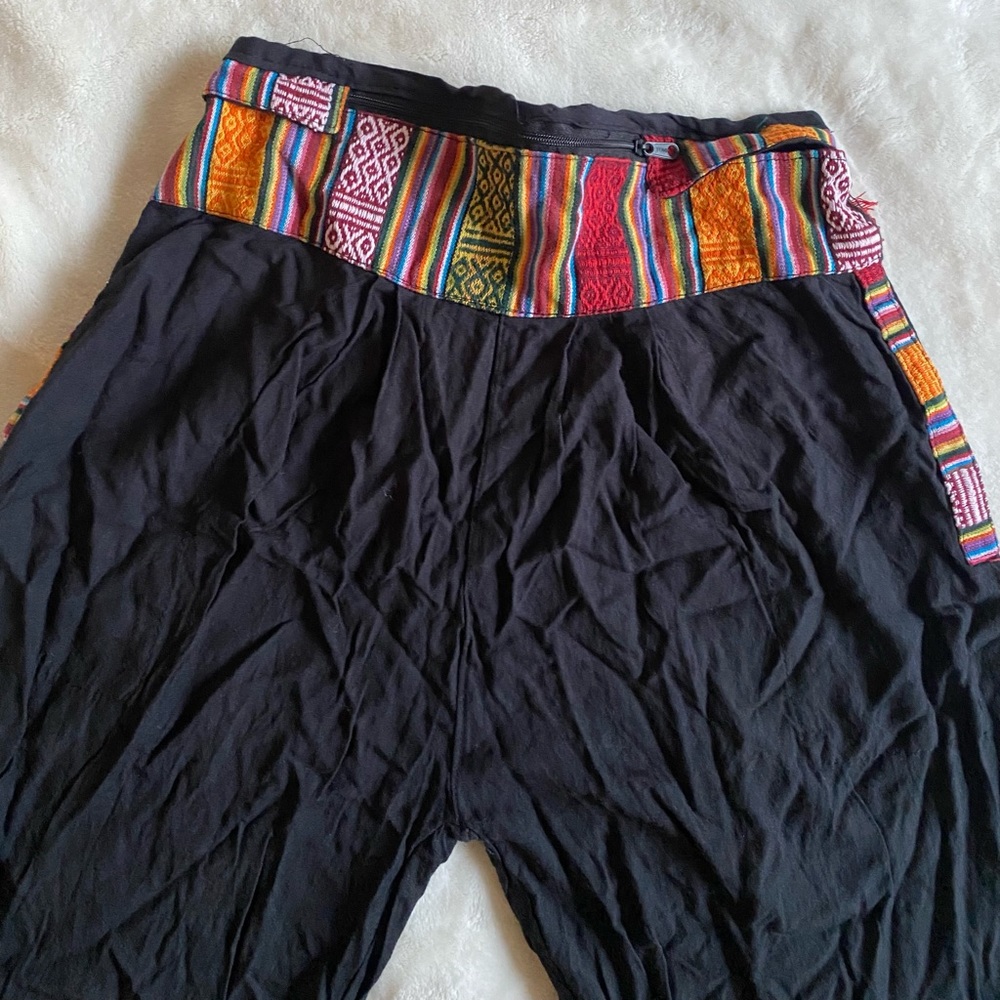 Harem Style Black pants with design. Design on leg cuff. Slightly used